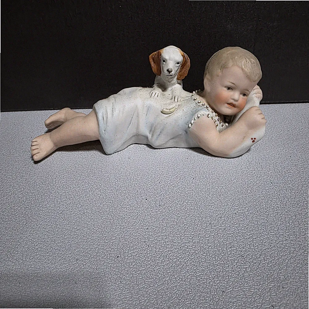 Antique Bisque Porcelain Piano Baby Figurine with Dog Reclining Child 7 Inch